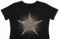 Black women's fashion tee with glitter starburst chest graphic catching studio strobe in sharp sparkle